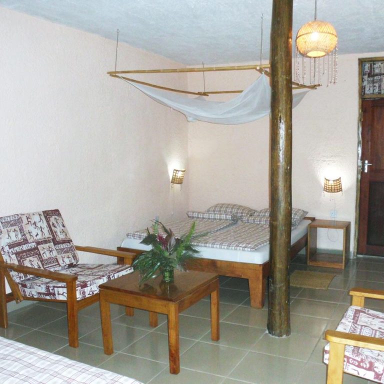 Seating and bed in a Standard Mbega room